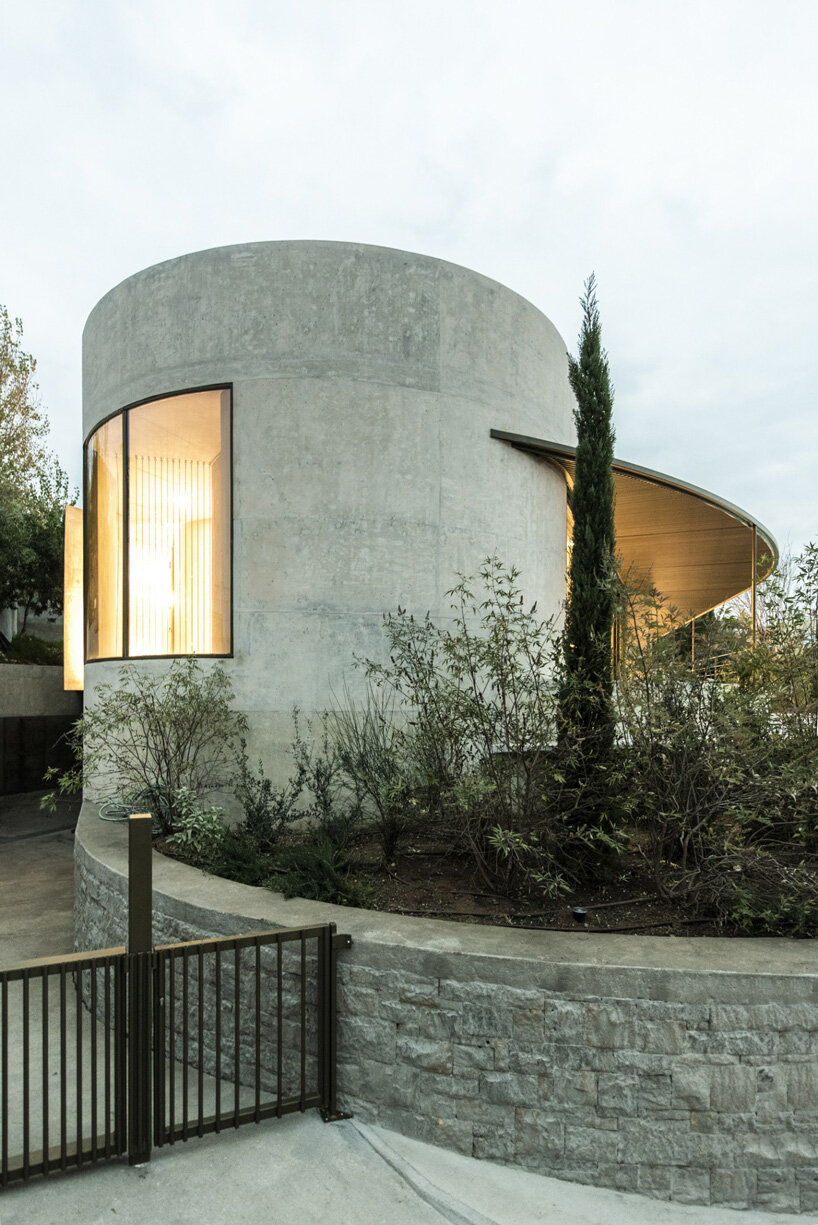 tense architecture network adds circular pool to concrete island residence in greece