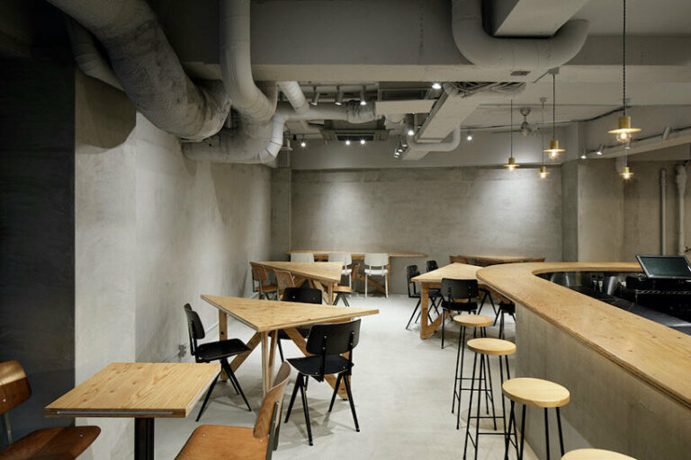 UENOA installs transformable triangular table system in tokyo dining space