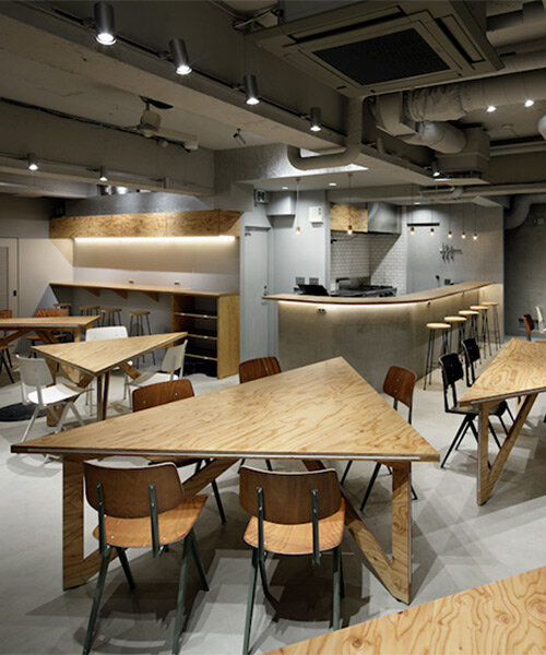 UENOA installs transformable triangular tables in underground tokyo dining space