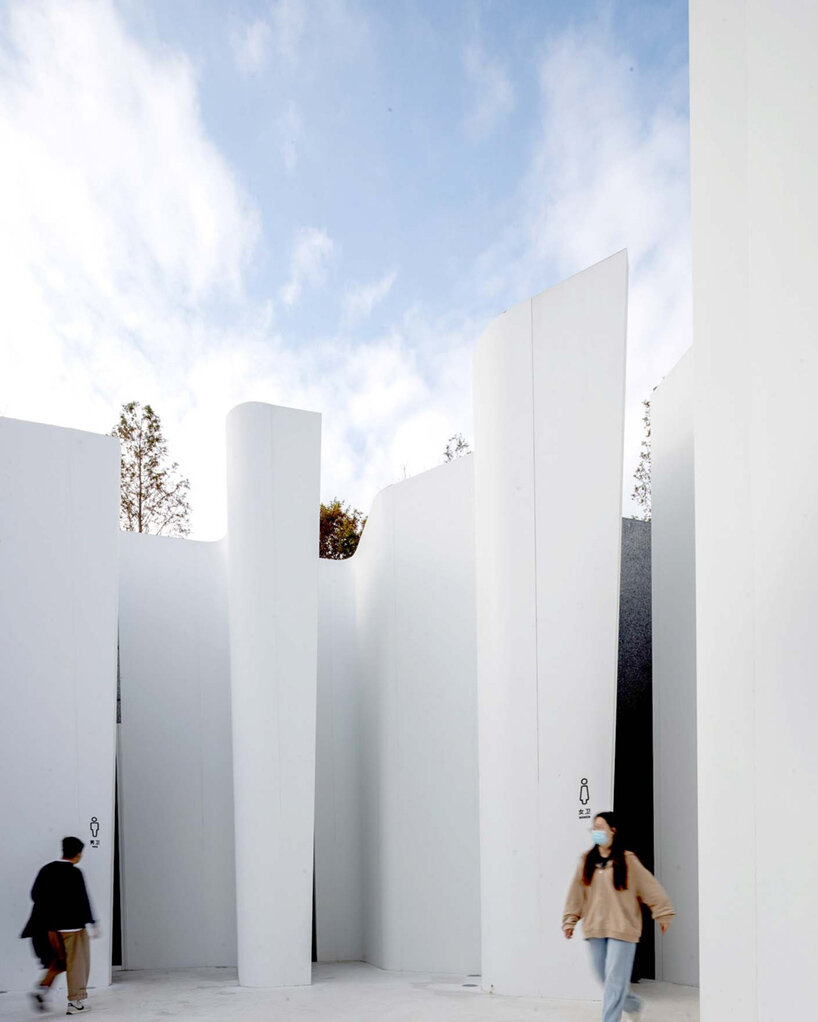 a public toilet in china's atour village is embedded into the hillside