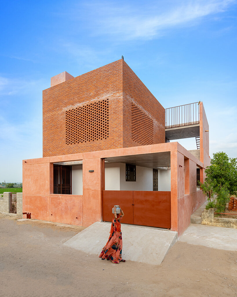 brick perforations and diverse cutouts characterize family house in india