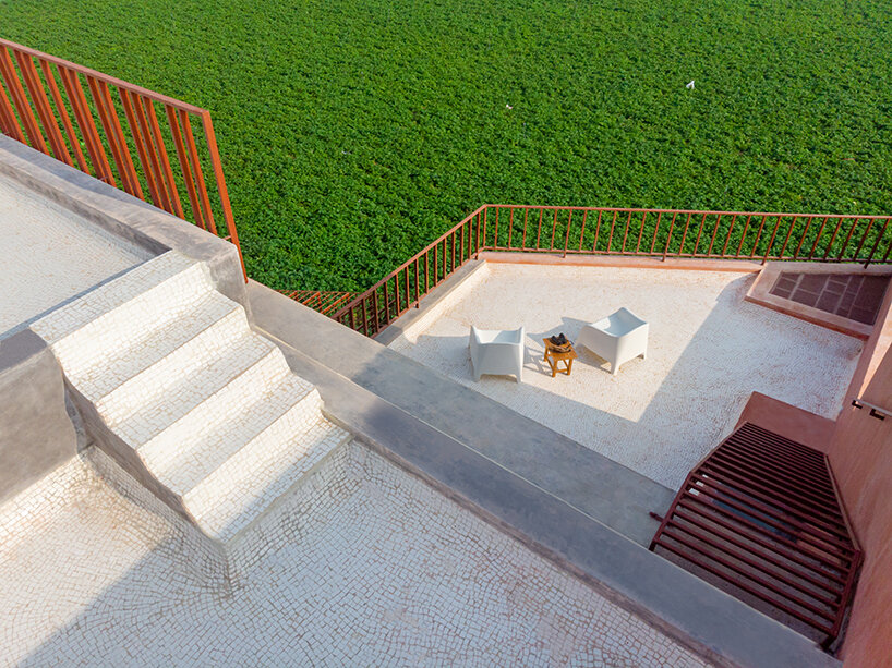 brick perforations and diverse cutouts characterize this family house in india