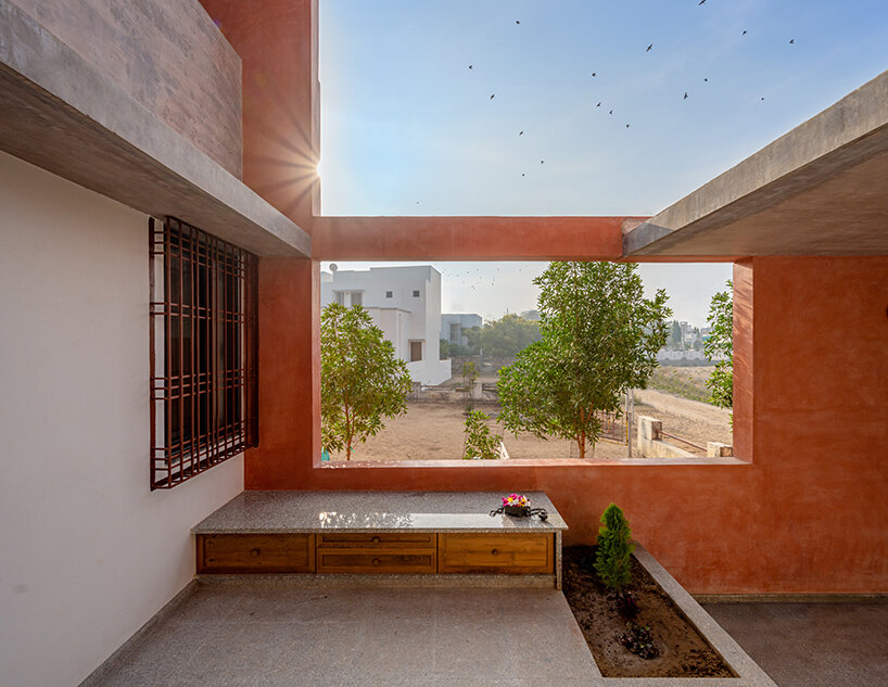 brick perforations and diverse cutouts characterize this family house in india