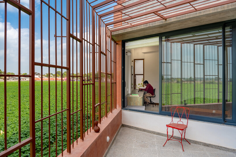 brick perforations and diverse cutouts characterize this family house in india