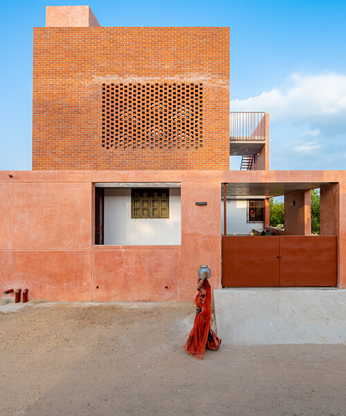brick perforations and diverse cutouts characterize this family house in india