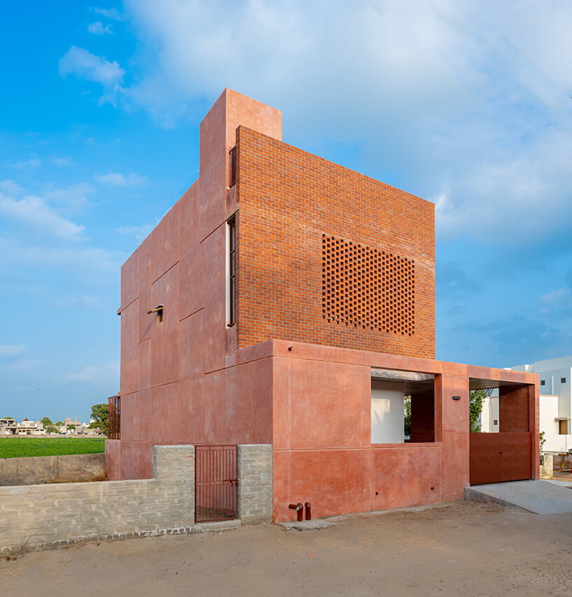 brick perforations and diverse cutouts characterize family house in india