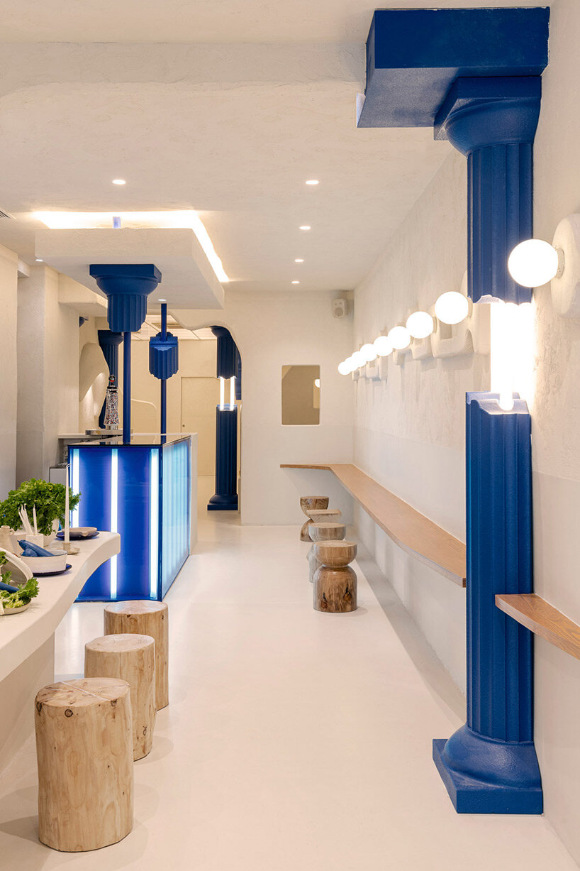 blue 3D printed ancient columns emerge from masquespacio's greek restaurant in spain