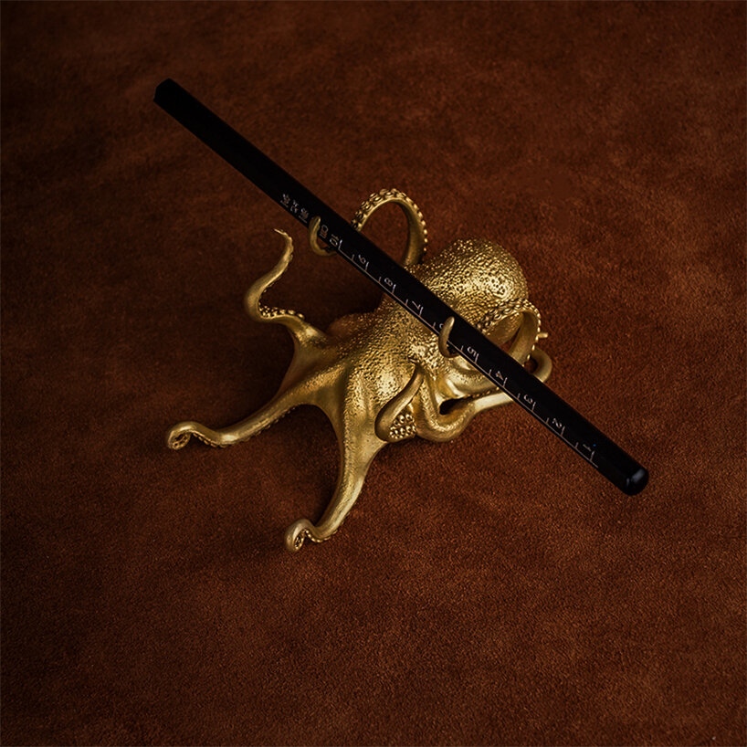 bronze octopus holder by coppertist.wu is the perfect desk accent