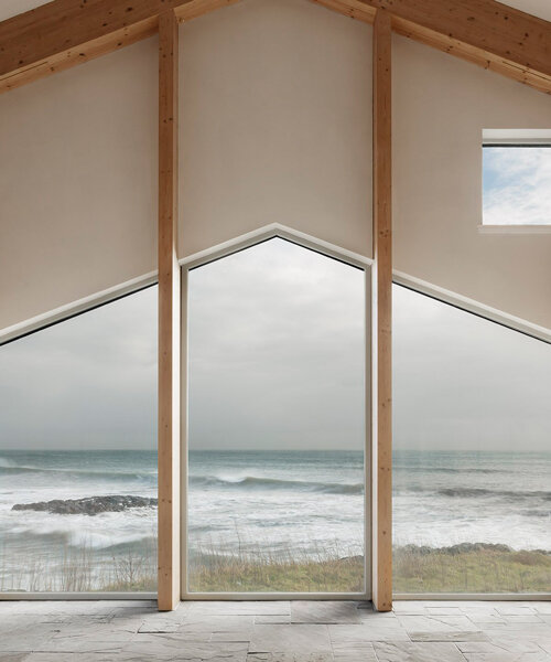 denizen works perches its luminous 'mannal house' atop the rocky coast of scotland