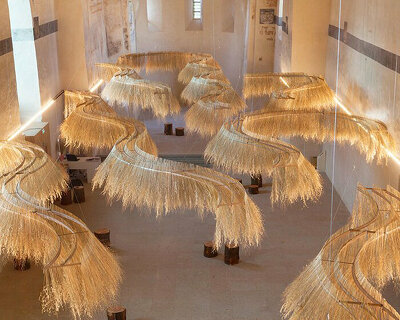 golden dried plant installation meanders within former french chapel