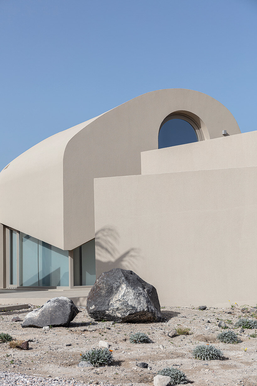 volcanic rock-like forms and earthy tones build kapsimalis architects' house in santorini