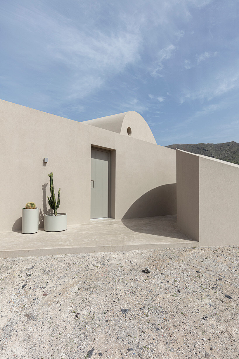 volcanic rock-like forms and earthy tones build kapsimalis architects' house in santorini