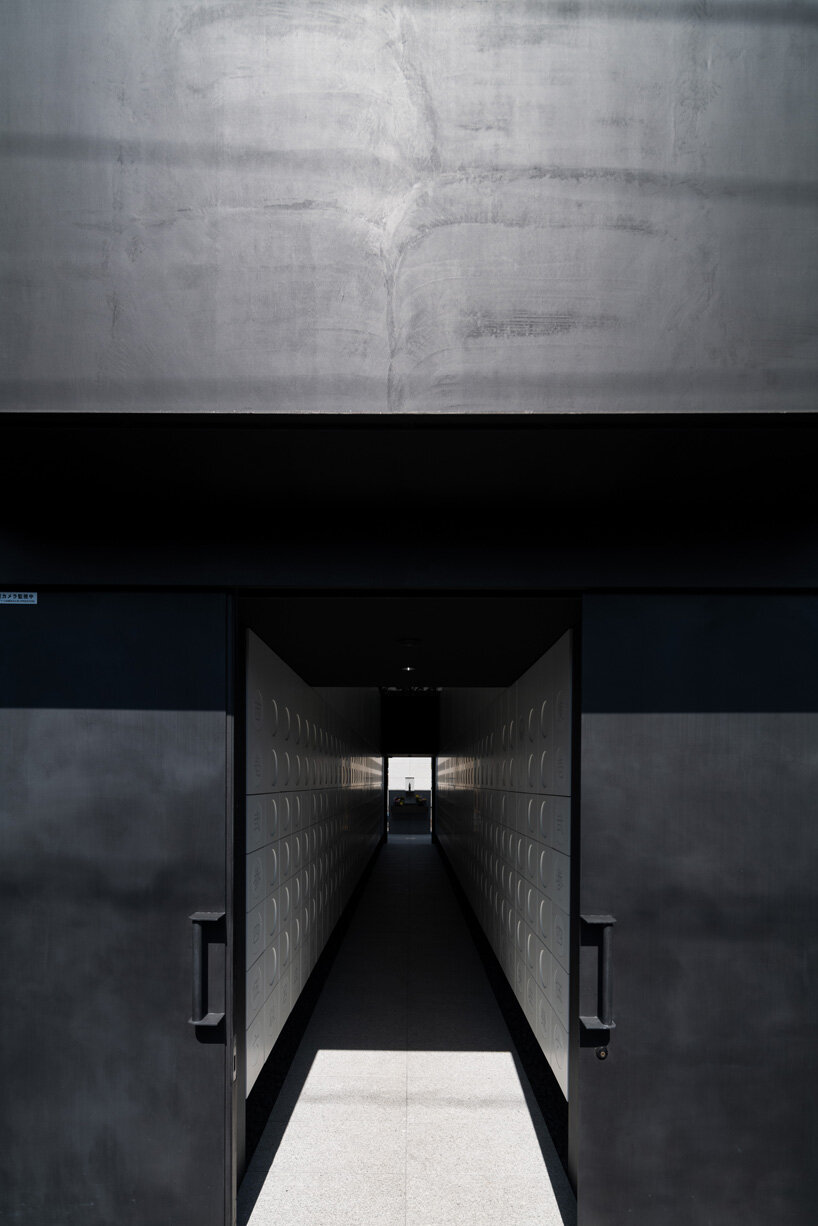 black tones unify this japanese temple's ossuary and tree burial facility by love architecture