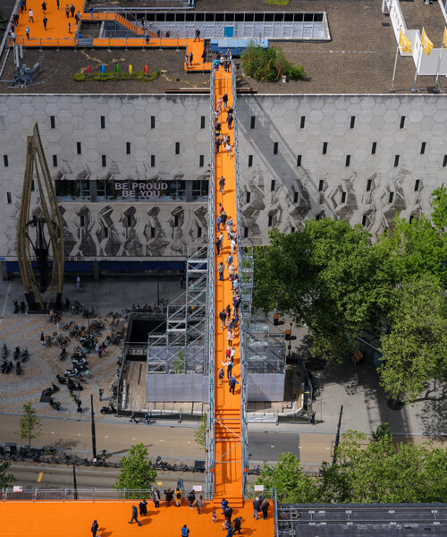 a bright orange rooftop walk designed by MVRDV opens in rotterdam