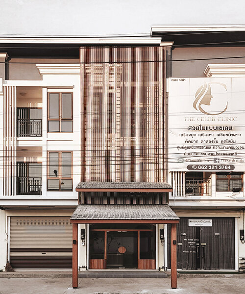 wood and terracotta shape this two-part facade design in thailand