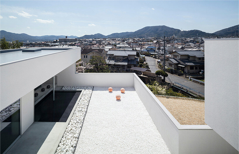 tranquil water basin casts rippling visuals within residence by FORM / kouichi kimura in japan