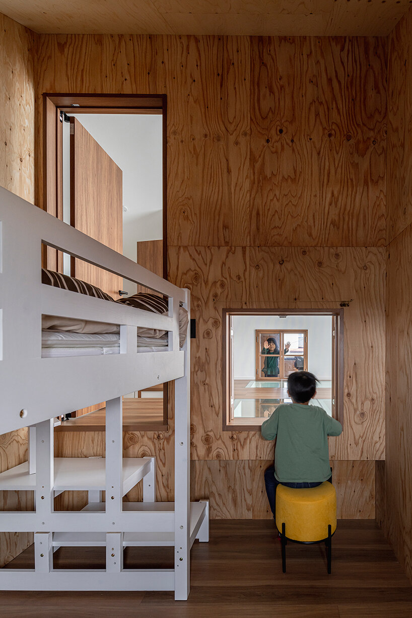 built around a common playroom, this japanese home celebrates sibling bonds