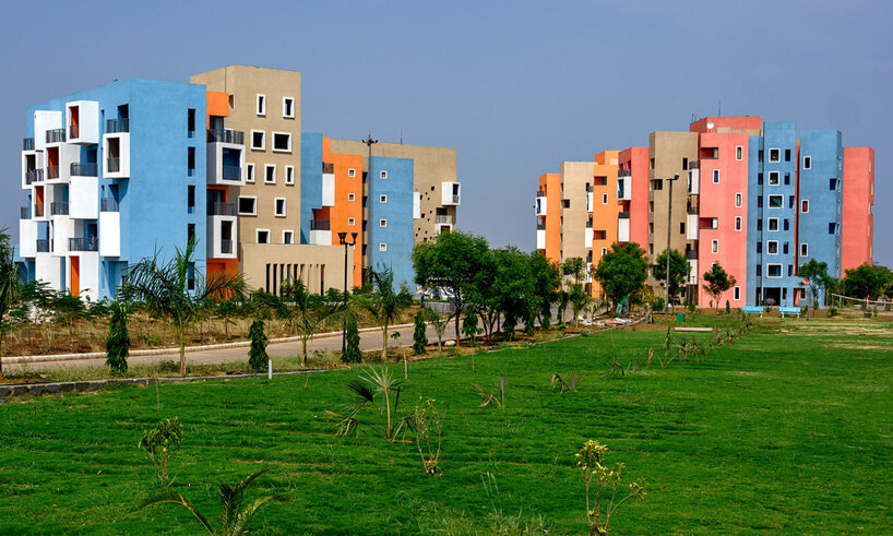 vibrant colors and boxy balconies make this housing project in india pop