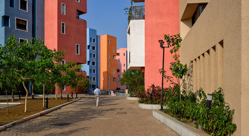 vibrant colors and boxy balconies make this housing project in india pop