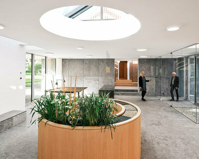natural stone, oak wood, and textured paint transform this traditional farm in denmark
