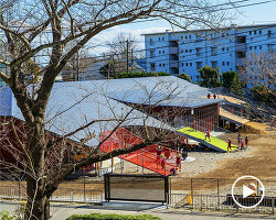 sloping playground roof tops renovated 50-year-old kindergarten by studio YY in japan