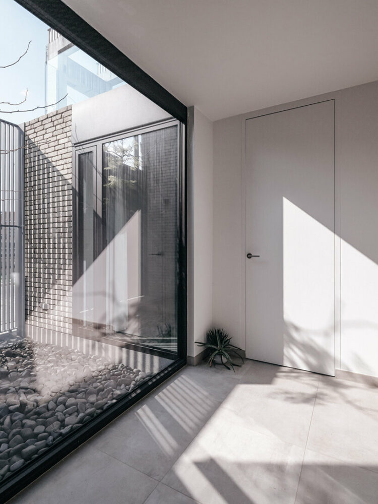 this belgian 'canal house' by studio farris is fronted by a secret garden