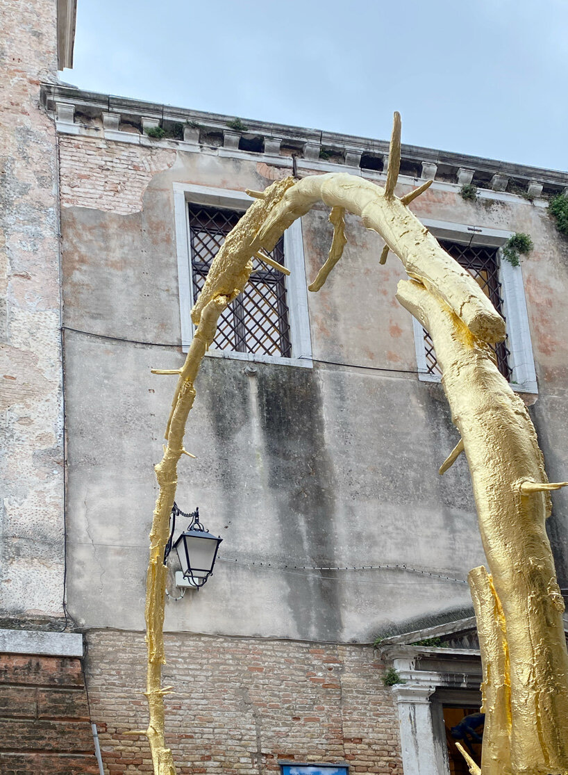 ugo rondinone brings human clouds, a gilded sun and colorful, burnt out candles to venice
