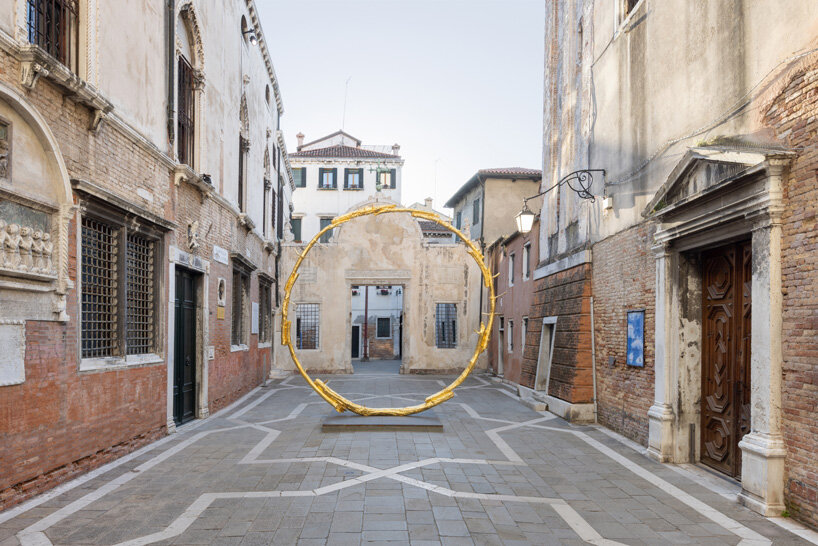 ugo rondinone brings human clouds, a gilded sun and colorful, burnt out candles to venice