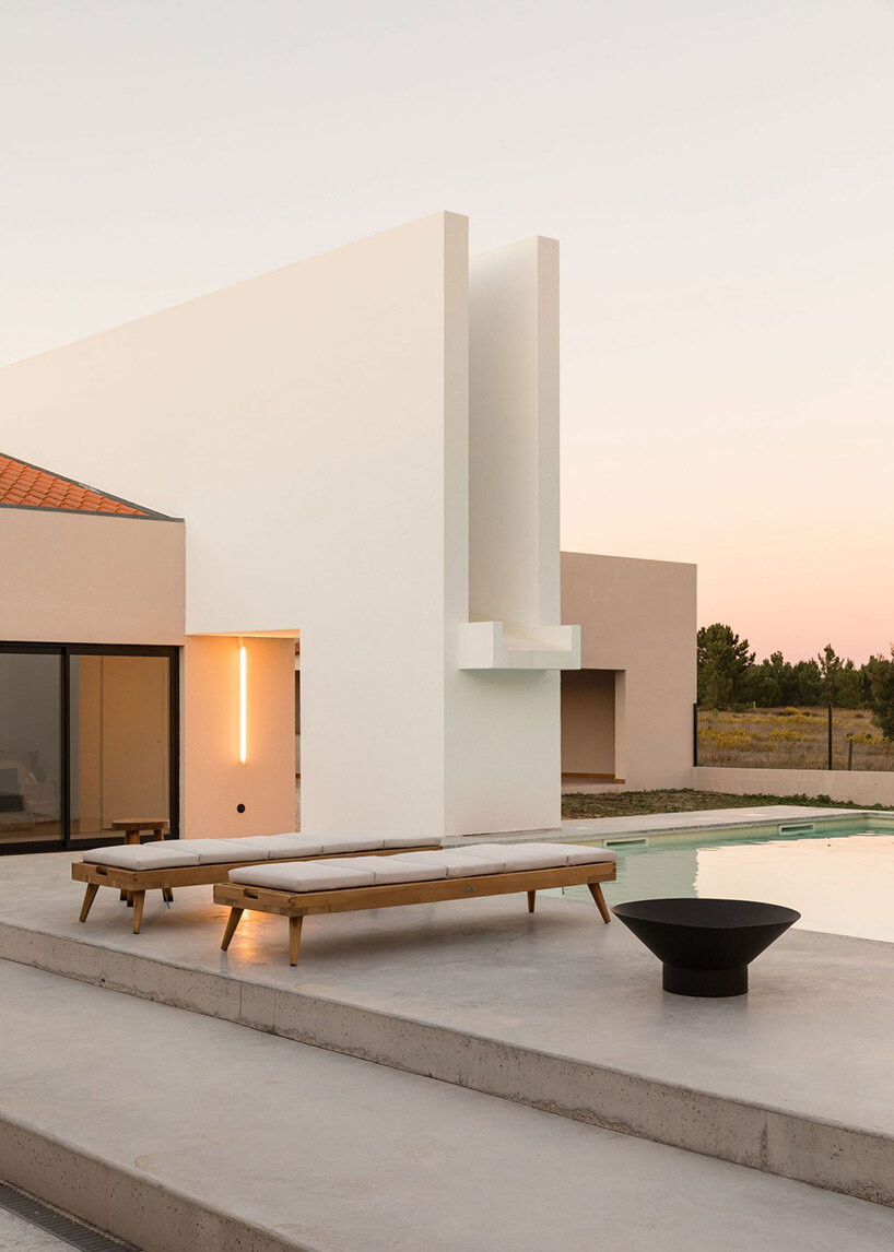 textured white & beige hues delineate boundaries within residential renovation in portugal
