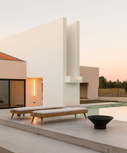 textured white & beige hues delineate boundaries within residential renovation in portugal