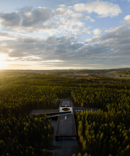 BIG's cross shaped factory in the norwegian woods gets ready for grand opening