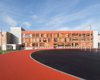 colorful brick cladding adorns school campus in france after sweeping makeover