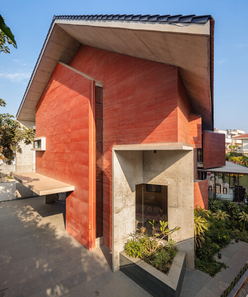anagram architects infuses red concrete house in india with whimsical playfulness
