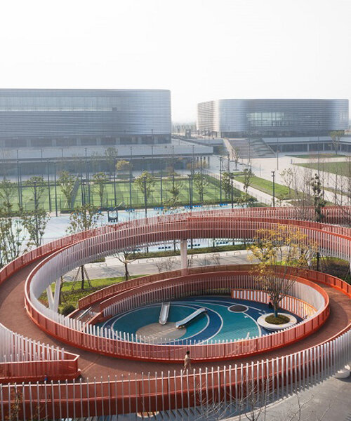 spiraling bright orange corridors wrap around playground in sichuan, china