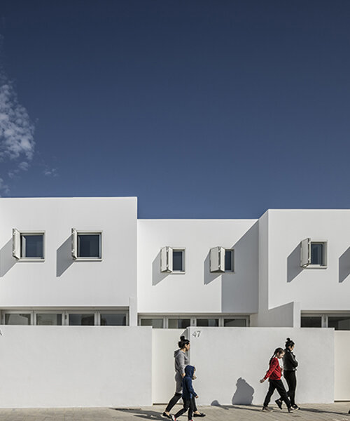 nada's all-white residential complex in valencia takes cues from mediterranean villages