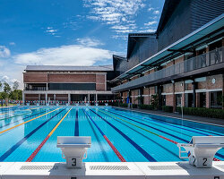 origami-shaped roof characterizes archicentre's 'estuari sports centre' in malaysia