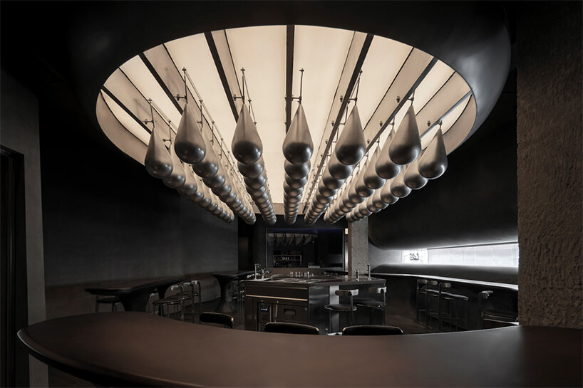 eye-catching waterdrop installation adorns the ‘flow bar & lab’ in china