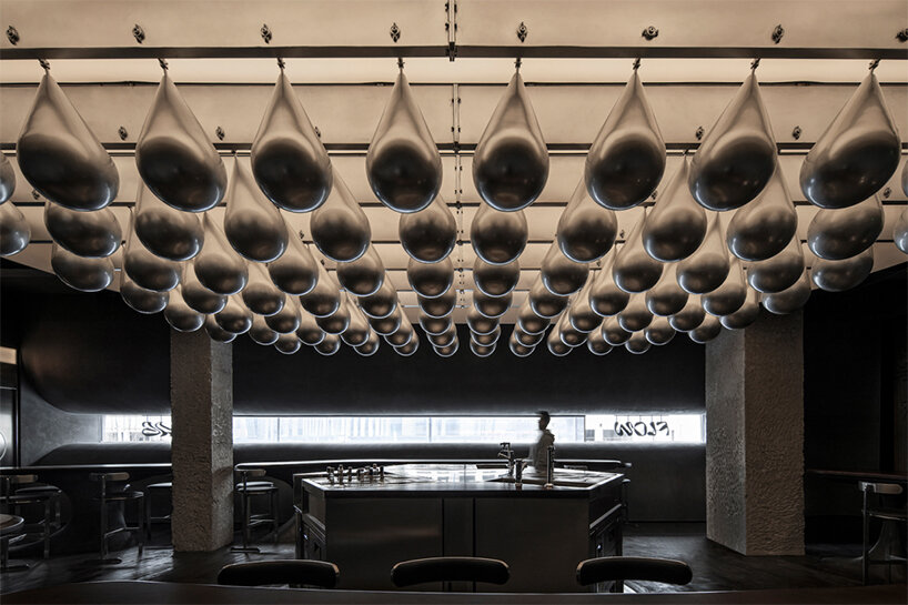 eye-catching waterdrop installation adorns the ‘flow bar & lab’ in china