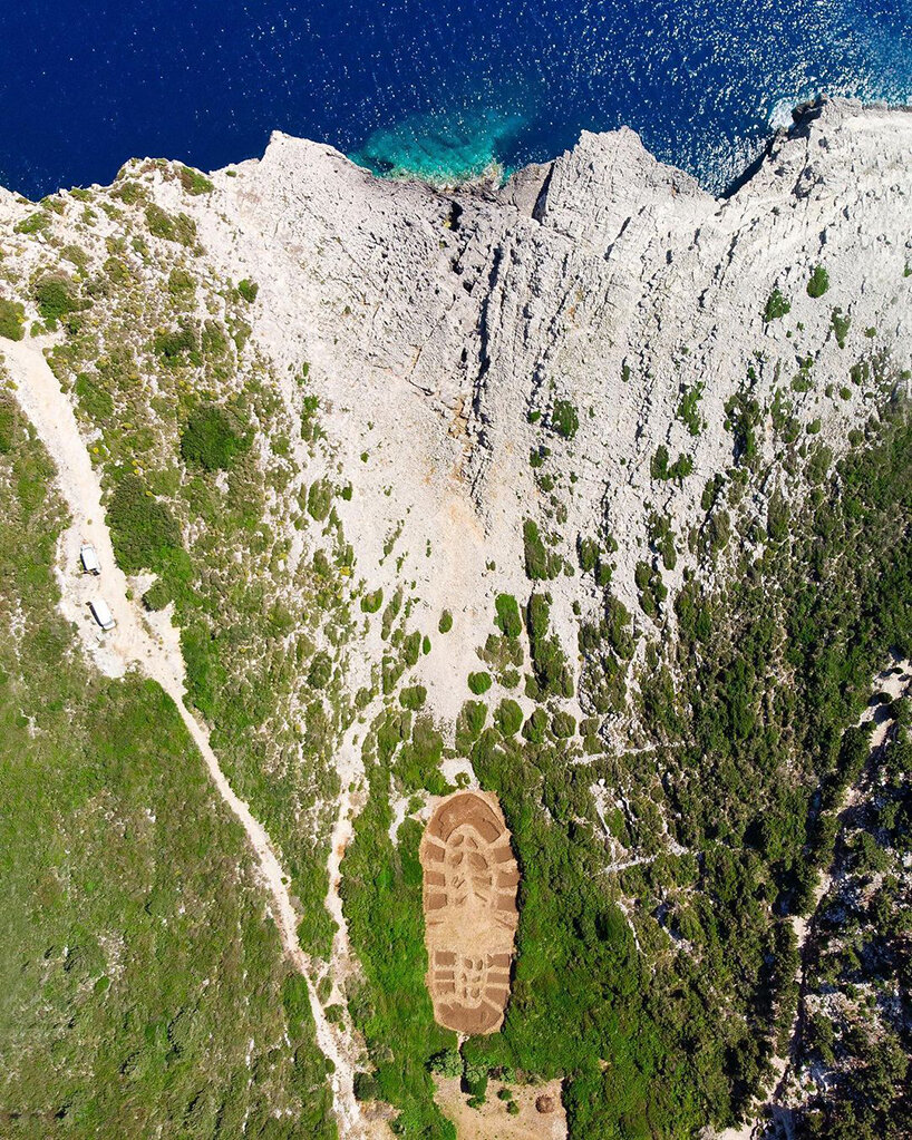 this 1,000 sqm land art in greece echoes humanity’s destructive ecological footprint