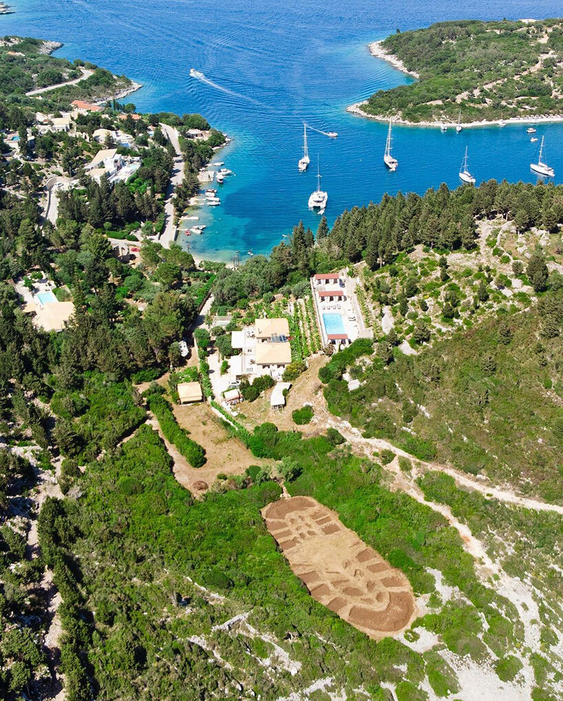 this 1,000 sqm land art in greece echoes humanity’s destructive ecological footprint