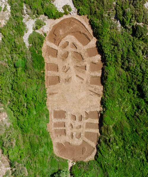 this 1,000 sqm land art in greece echoes humanity’s destructive ecological footprint