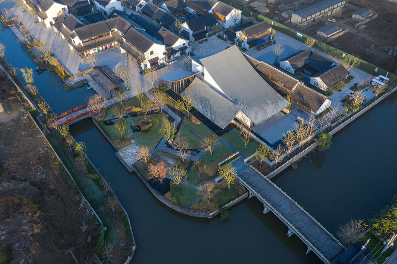 a series of hyperbolic shaped roofs tops GOA's jianli art center in china