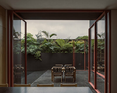 step inside lopez gonzalez studio's dark-toned residence in xalapa, mexico