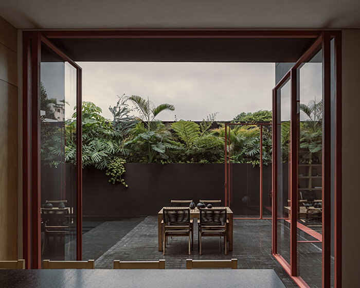 step inside lopez gonzalez studio's dark-toned residence in xalapa, mexico