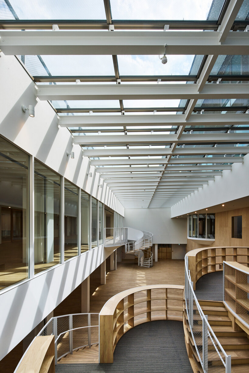 kengo kuma wraps yokohama campus building in a facade of folding timber panels