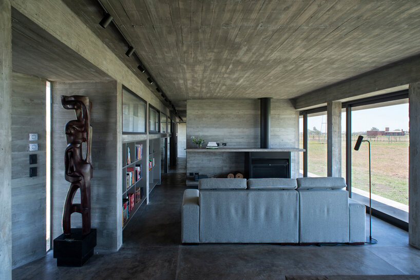 luciano kruk shapes one long concrete volume for 'countryside house' in argentina