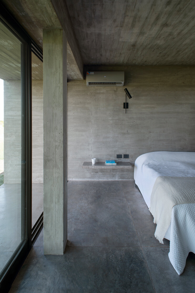 luciano kruk shapes one long concrete volume for 'countryside house' in argentina