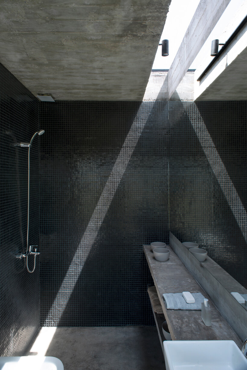 luciano kruk shapes one long concrete volume for 'countryside house' in argentina