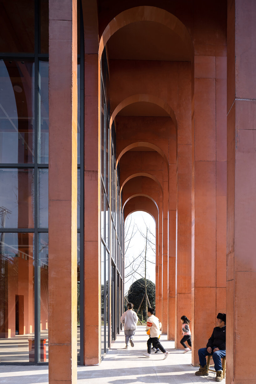 MUDA-architects adds red concrete arcades to tourist center in china