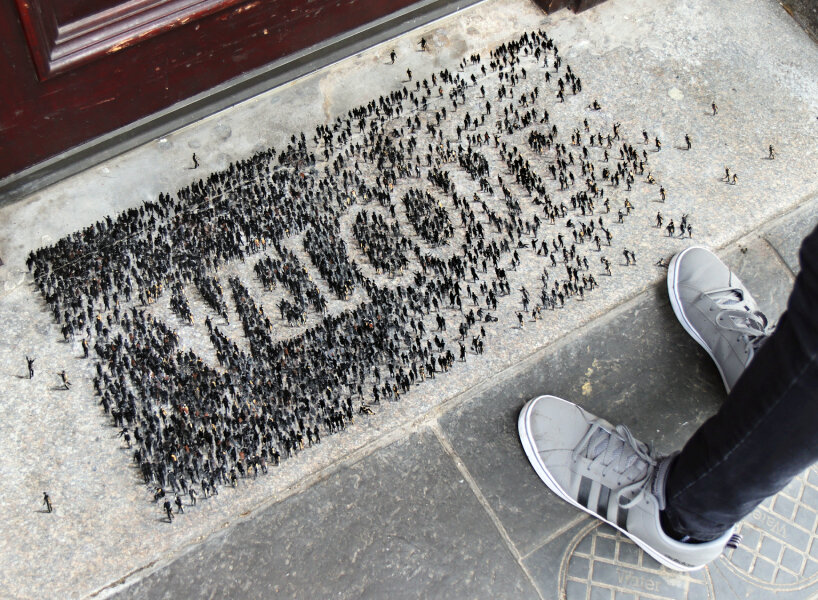 tiny figures by PEJAC drawn as WELCOME in aberdeen to support marginalized people